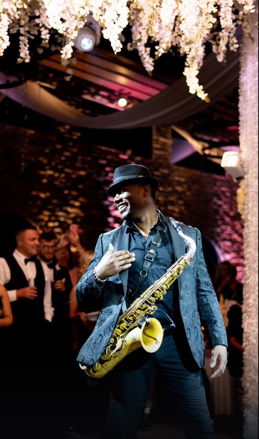 Saxy Rob in a blue jacket with his saxophone